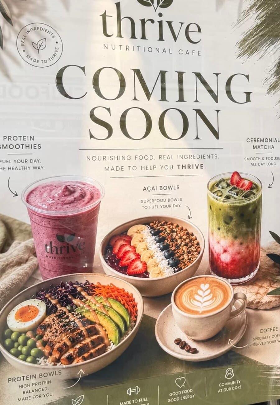 Thrive coming soon poster in the shop window on Woodville Road